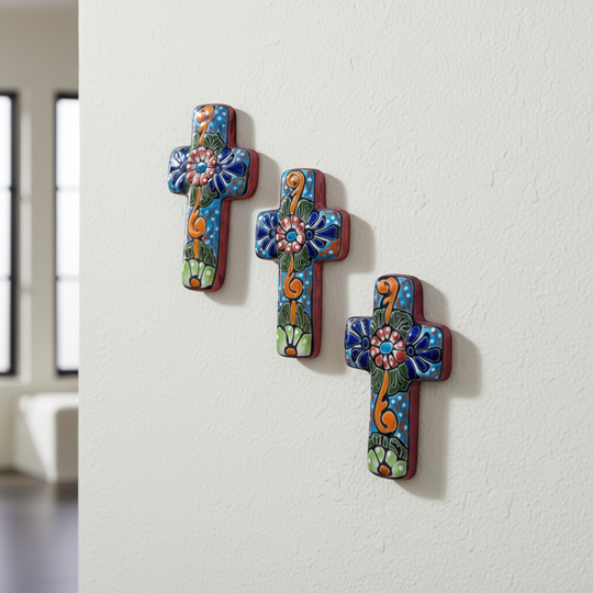 The Talavera Hub set of 3 small, handcrafted ceramic crosses with blue, orange, and green floral Talavera designs.