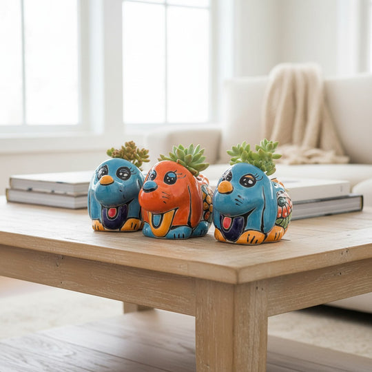 The Talavera Hub small blue hand-painted Talavera dog planter with intricate floral details and a happy expression.