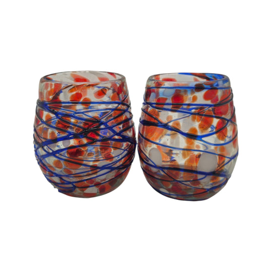 The Talavera Hub hand-blown stemless wine glasses with orange, blue, and white swirl pattern. Recycled glass, 12 oz capacity.
