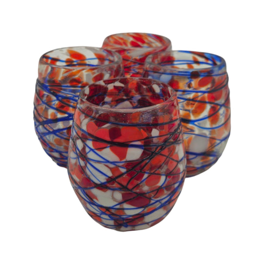 The Talavera Hub hand-blown stemless wine glasses with red, white, and blue swirl pattern. Recycled glass, 12 oz capacity.