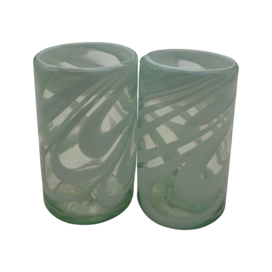 The Talavera Hub hand-blown clear glass drinking glasses with white swirl pattern, 18 oz capacity.