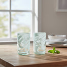 The Talavera Hub hand-blown clear glass drinking glasses with white swirl pattern, 18 oz capacity.
