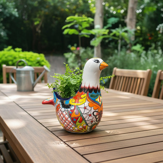 The Talavera Hub large ceramic dove planter, hand-painted with vibrant floral and geometric patterns in blue, orange, yellow, and red.