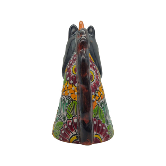 Rear view showing the colorful painted patterns and mane of a unicorn head statue