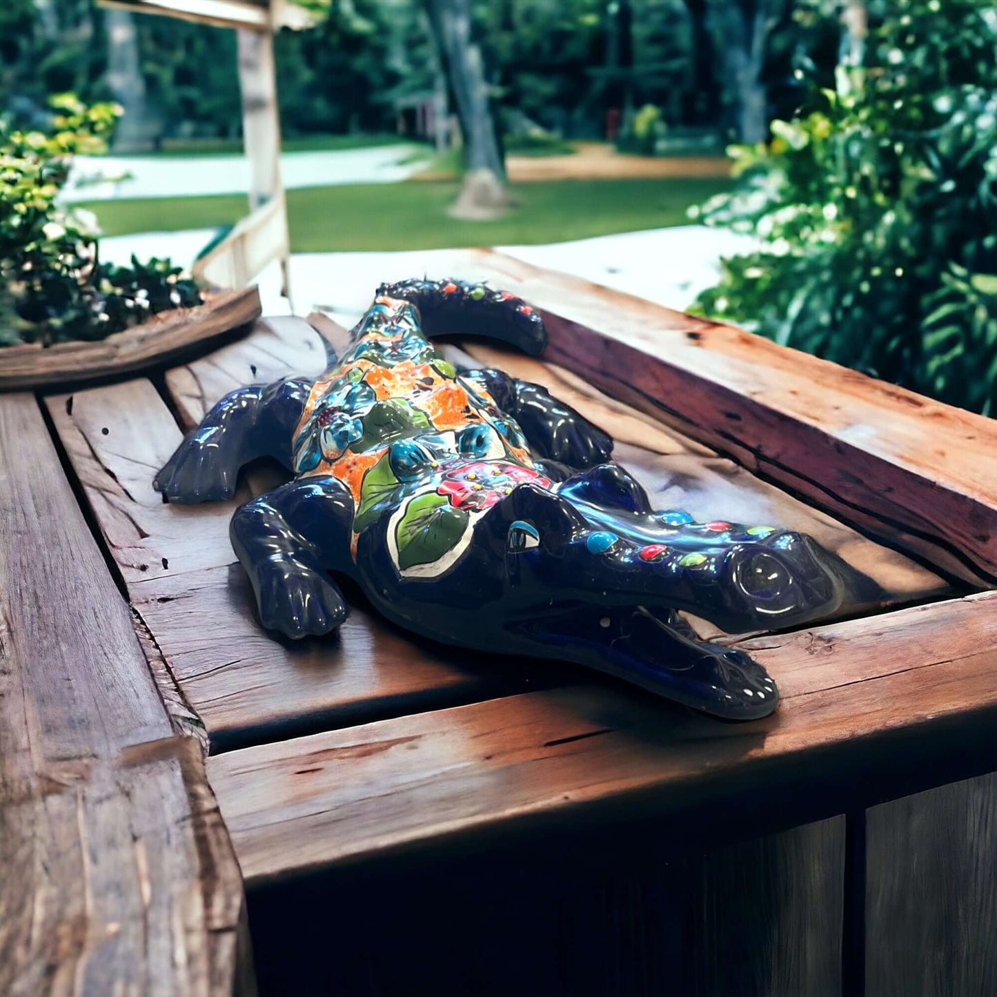 Vibrant Talavera Alligator | Large Mexican Handmade Ceramic Reptile Art - hand-painted Talavera alligator sculpture on wooden porch