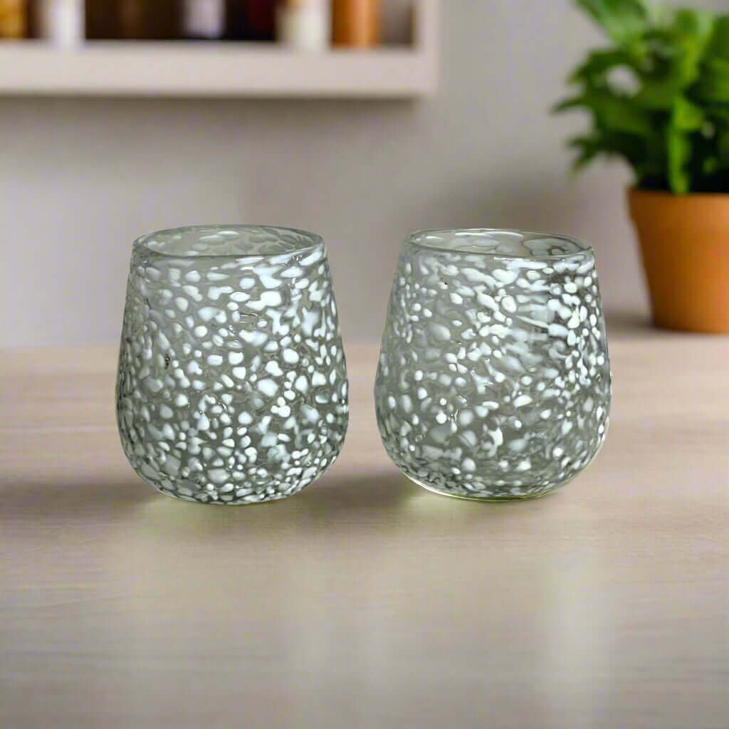 White Pebbled Wine Glass | Hand-Blown Mexican Stemless Glassware - pair of frosted, hand-blown white pebbled stemless glasses on a table
