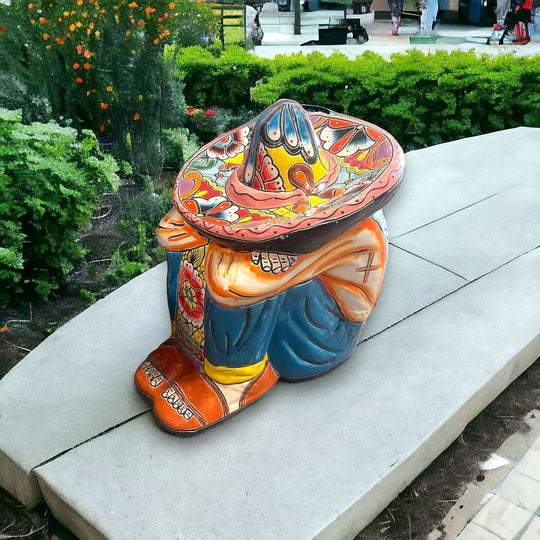 Talavera Panchito Sleeping Man Figurine | XL Hand-Painted Art - large hand-painted Talavera statue with colorful sombrero on outdoor bench